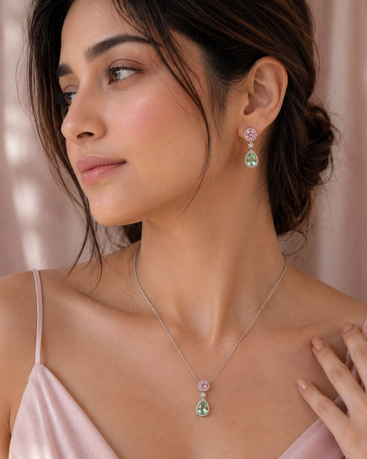 model close-up of the pink round-cut and green pear-cut stones on the PEHRO jewellery set