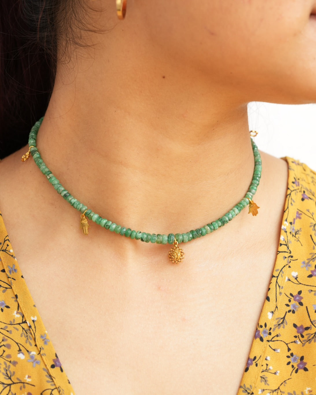 Natural Brazilian emerald beaded choker necklace with Om lotus, hamsa and clover charms in 925 sterling silver with 18K gold vermeil