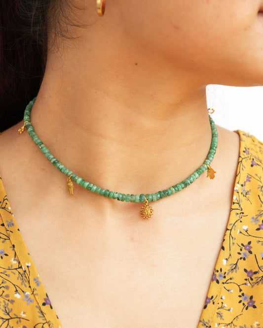 Natural Brazilian emerald beaded choker necklace with Om lotus, hamsa and clover charms in 925 sterling silver with 18K gold vermeil