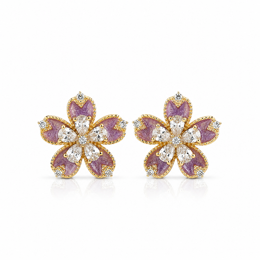 Pair of flower-shaped stud earrings with purple enamel petals and clear stone accents.
