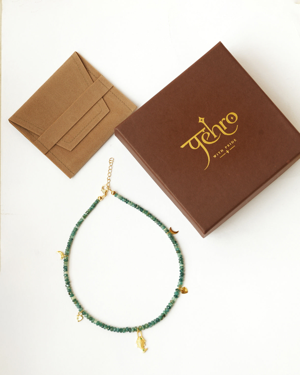925 sterling silver gemstone necklace with green-blue beads, gold-toned charms, PEHRO jewellery box, and jewellery care card.