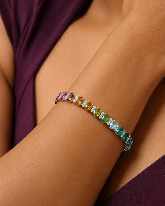 Close-up of the rainbow gradient and brilliant white stones on the PEHRO Tennis Bracelet