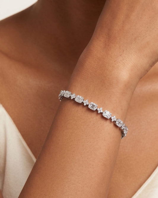 925 Sterling Silver emerald-cut tennis bracelet with alternating brilliant stones and rhodium plating by PEHRO