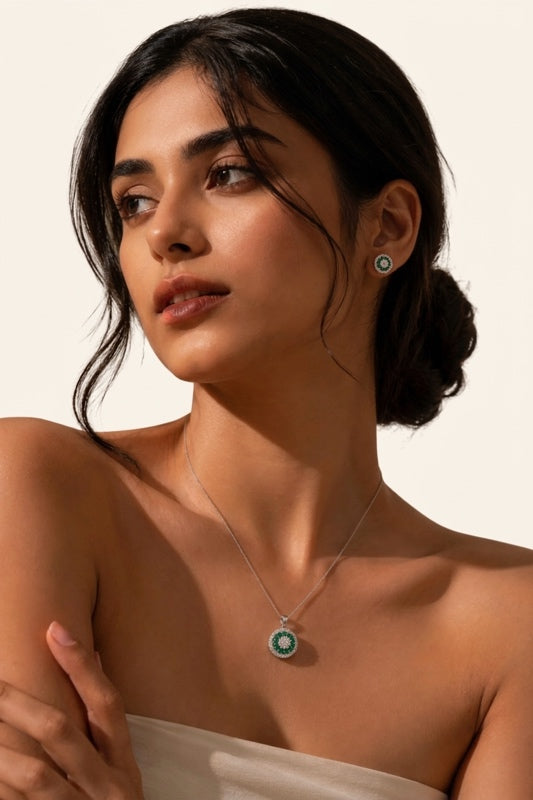 925_sterling_silver_emerald_necklace_and_matching_stud_earrings_on_a_woman