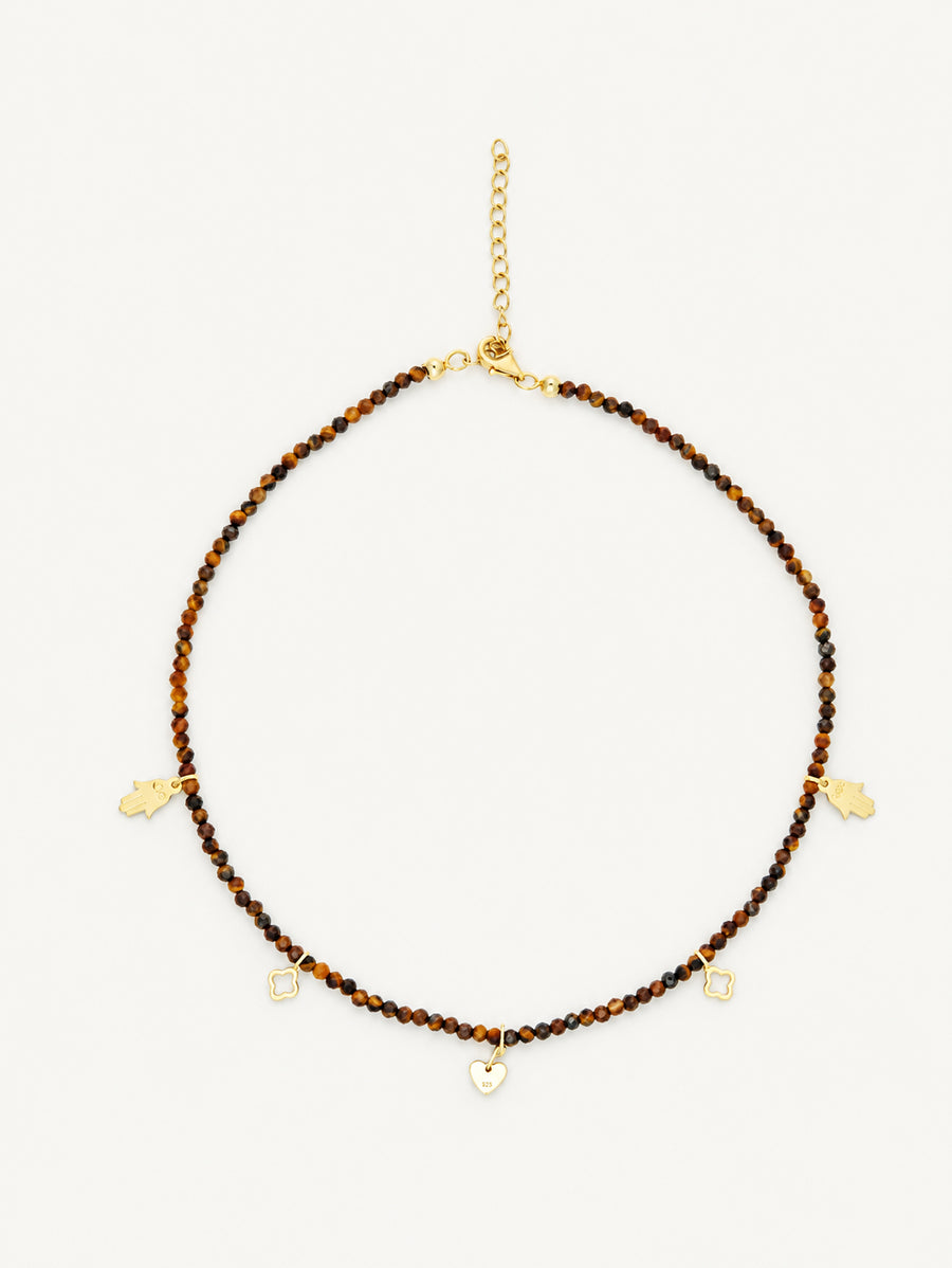 natural Tiger Eye beads with faceted surfaces and a gold-tone