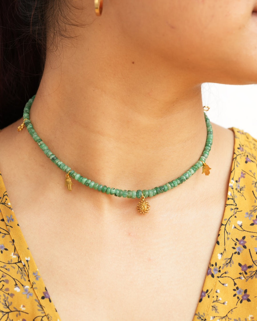 Natural Brazilian emerald beaded choker necklace with Om lotus, hamsa and clover charms in 925 sterling silver with 18K gold vermeil