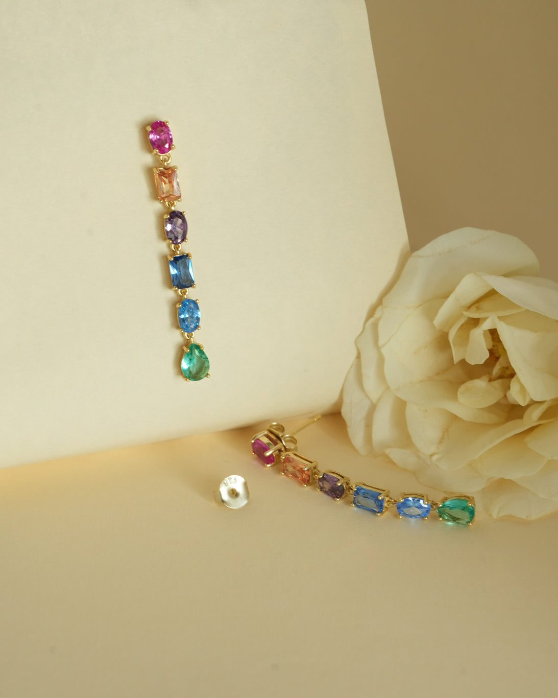 Close-up of the rainbow-coloured stones on the PEHRO Gold Vermeil Drop Earrings