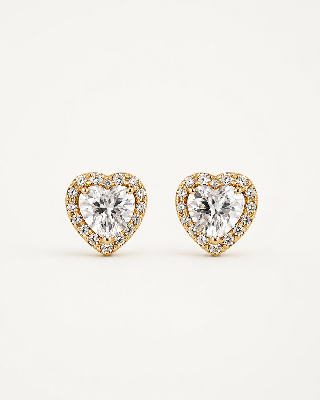 Close-up of the heart-cut halo stud earrings by PEHRO