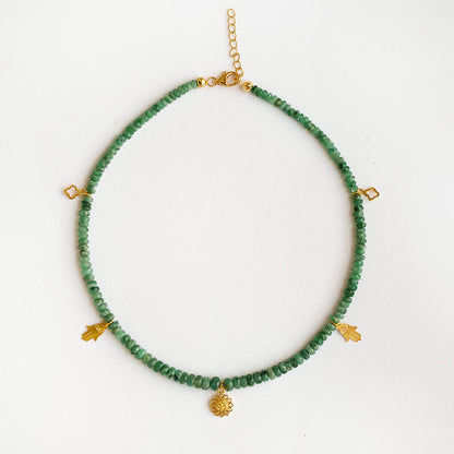 Faceted natural Brazilian emerald rondelle beads with gold vermeil Om lotus charm on a 925 sterling silver choker