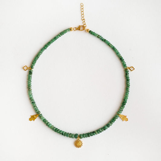 Faceted natural Brazilian emerald rondelle beads with gold vermeil Om lotus charm on a 925 sterling silver choker