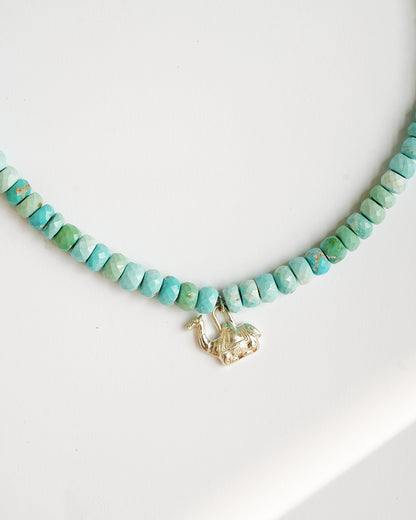 Close-up of natural Arizona turquoise beads arranged in a delicate necklace with 925 sterling silver accents
