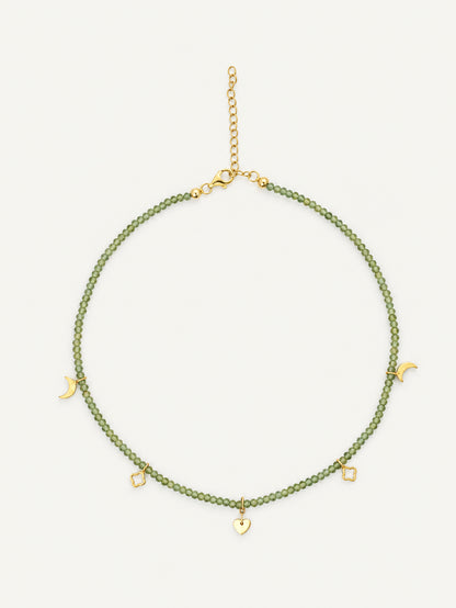 Faceted natural peridot gemstone choker with pale green beads and gold crescent, quatrefoil and heart charms by PEHRO