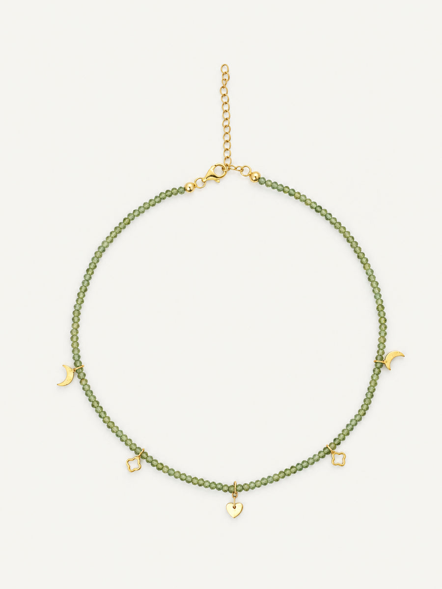 Faceted natural peridot gemstone choker with pale green beads and gold crescent, quatrefoil and heart charms by PEHRO