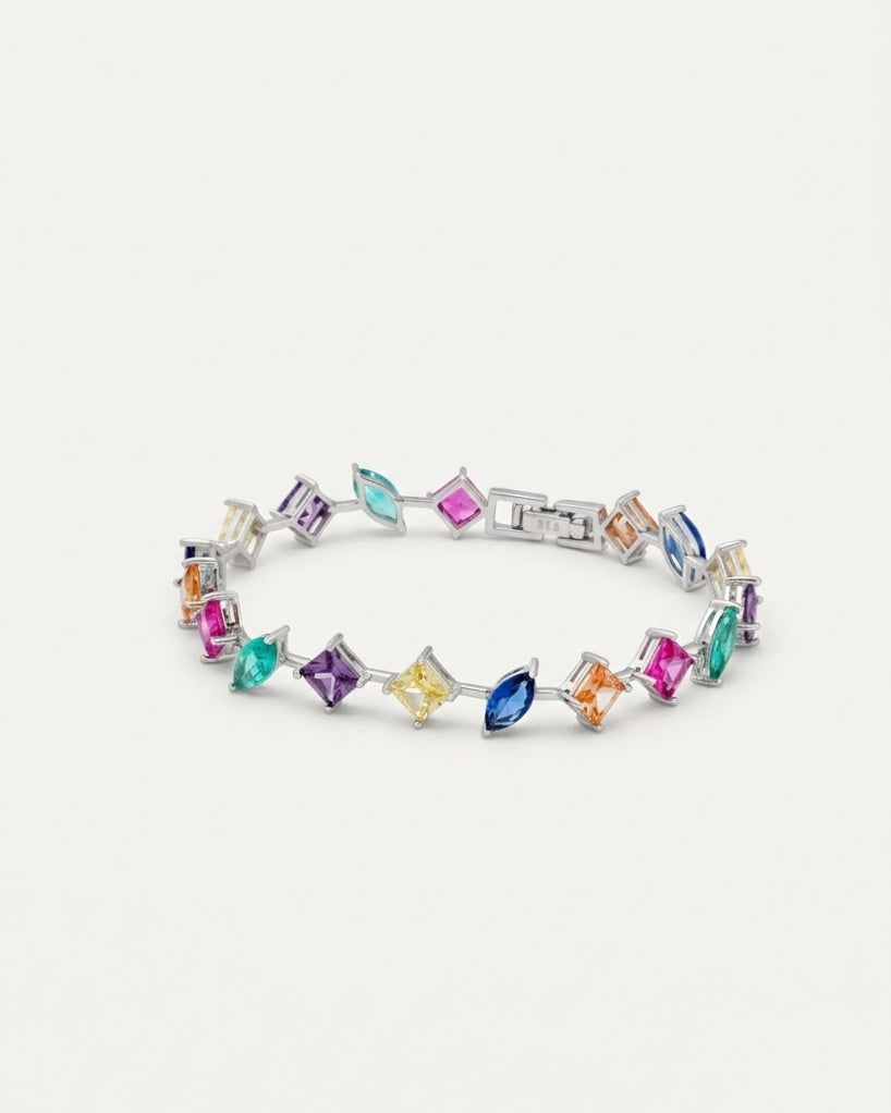 Studio top-down view of the 925 Sterling Silver Multicolor Station Bracelet set with brilliant radiant stones on a pure white background.
