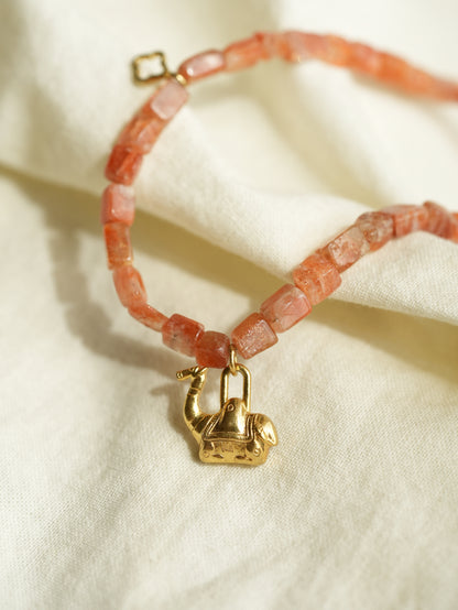 Natural peach sunstone beaded necklace with a gold-tone camel pendant