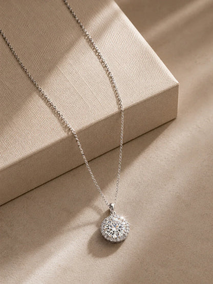 Close-up of the 3 carat round-cut moissanite halo pendant by PEHRO