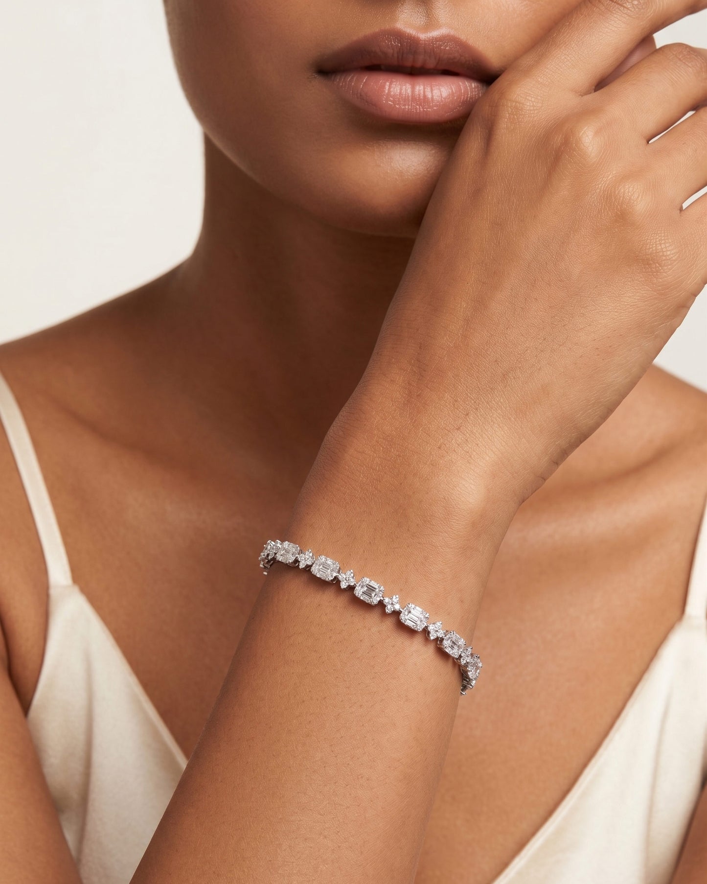 925 Sterling Silver emerald-cut tennis bracelet with alternating brilliant stones and rhodium plating by PEHRO