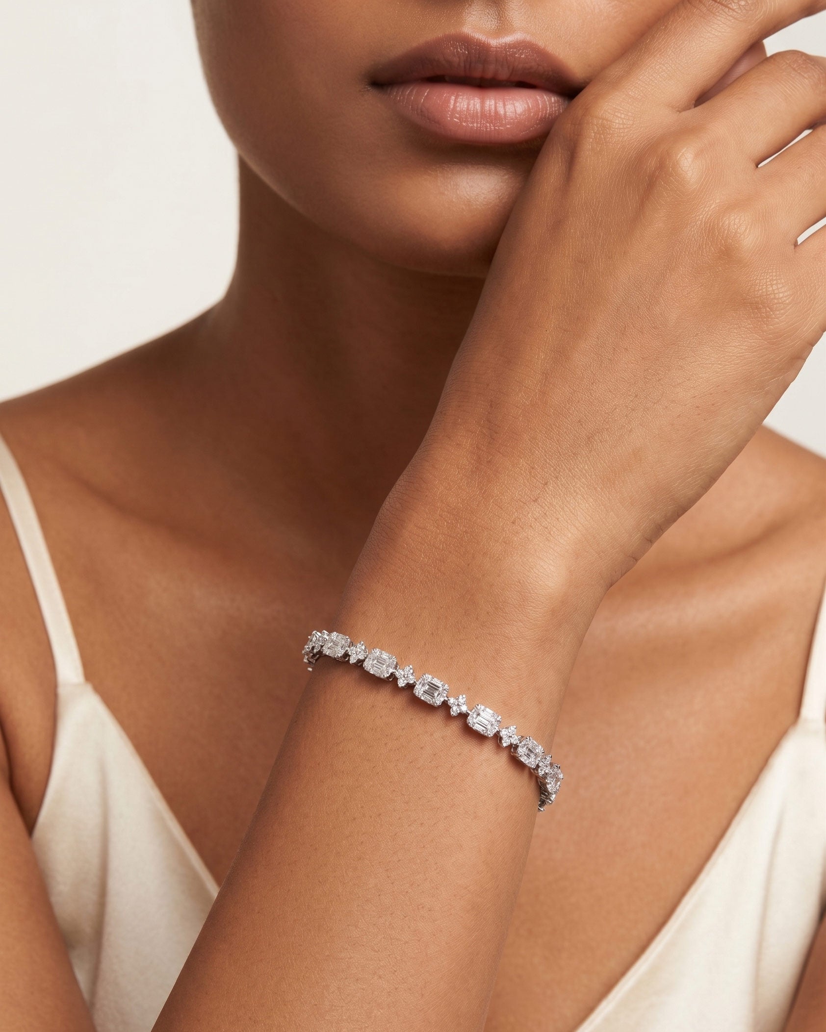 925 Sterling Silver emerald-cut tennis bracelet with alternating brilliant stones and rhodium plating by PEHRO