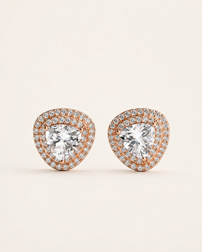 Rose gold-tone 925 sterling silver stud earrings with large pear-shaped brilliant stones and double halo detailing, on a light background.