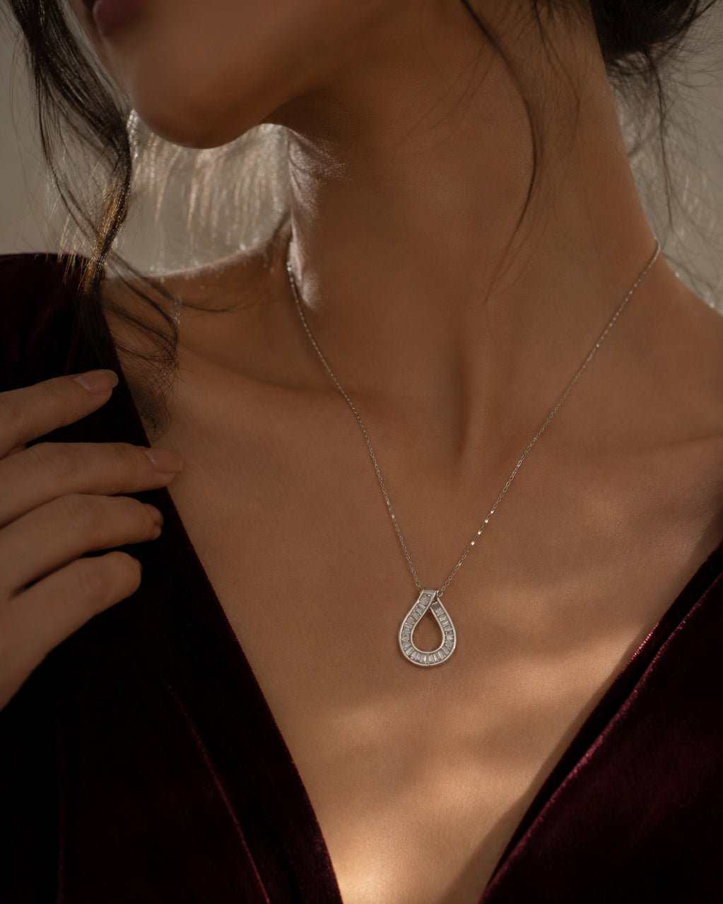 Close-up of the baguette-cut teardrop pendant on the PEHRO 925 Sterling Silver necklace