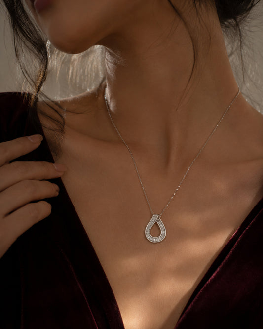 Close-up of the baguette-cut teardrop pendant on the PEHRO 925 Sterling Silver necklace
