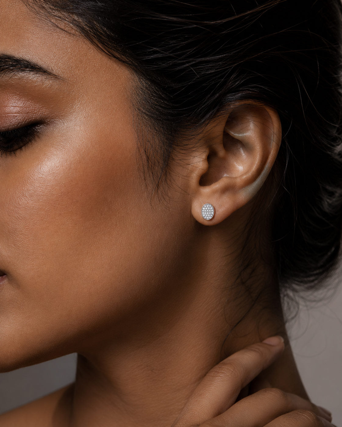 Woman wearing PEHRO 925 Sterling Silver Oval Pavé Stud Earrings