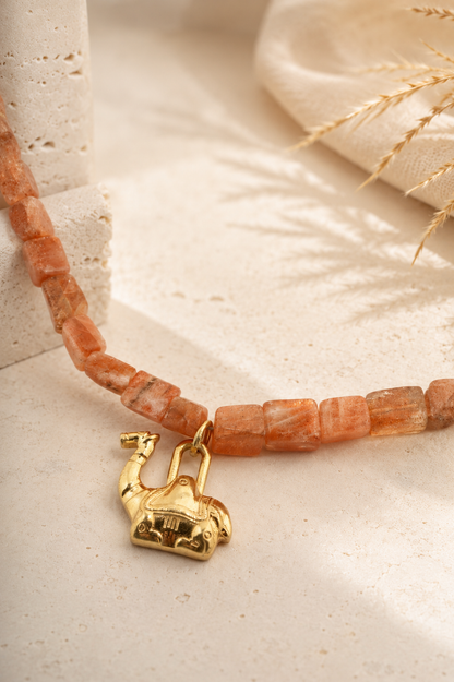 Close-up of the elephant charm and natural sunstone beads on the PEHRO Sunstone Choker