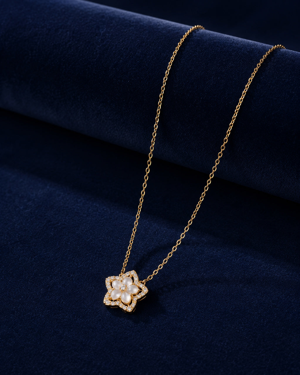 PEHRO 925 Sterling Silver Blossom Pendant Necklace displayed on navy blue velvet