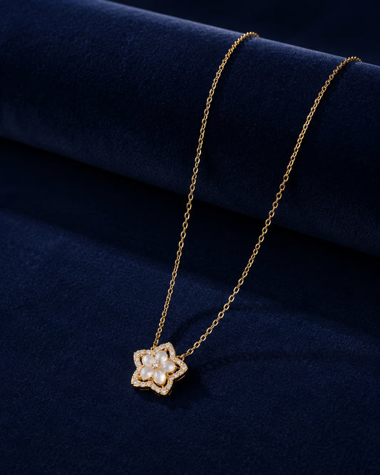 PEHRO 925 Sterling Silver Blossom Pendant Necklace displayed on navy blue velvet