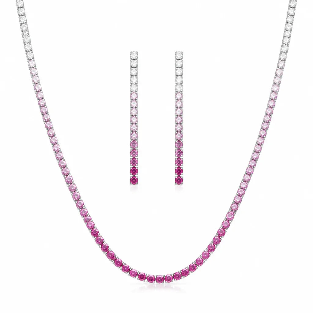 PEHRO pink stone tennis necklace and matching drop earrings set on a white jewelry display