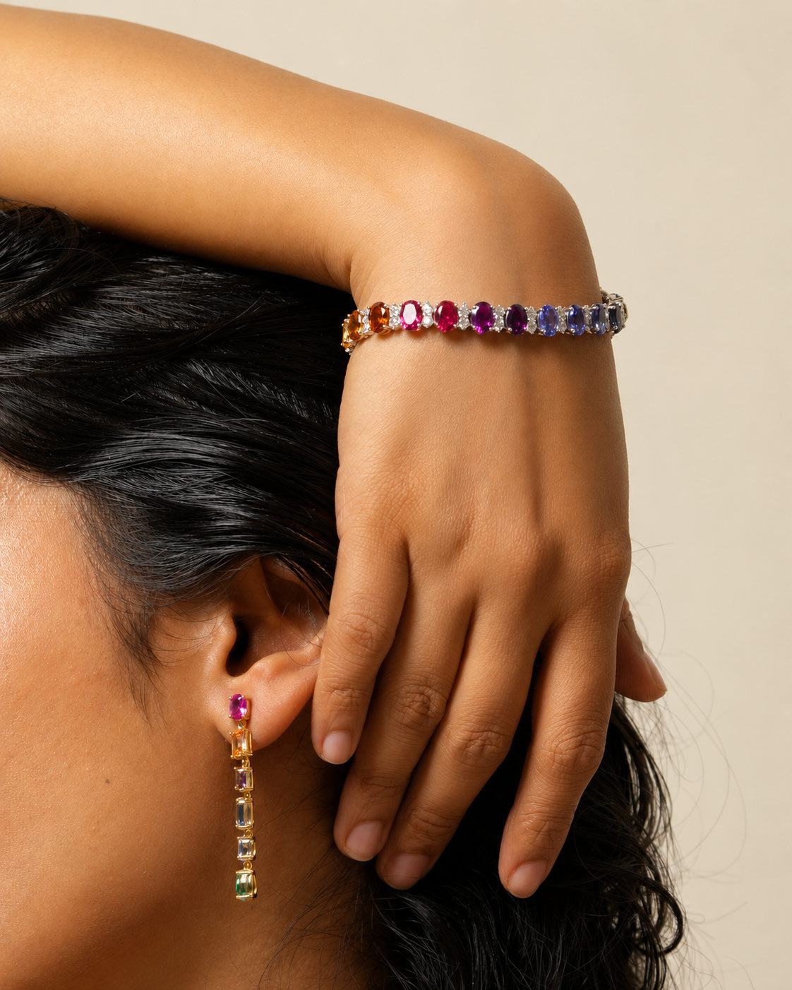 Close-up of the rainbow gradient and brilliant white stones on the PEHRO Tennis Bracelet